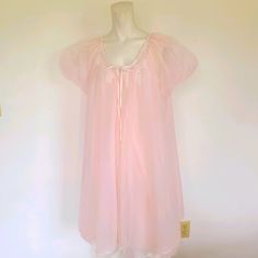 This Is A Gorgeous Vintage Nightgown And Robe Set From The 1950's Or 60's. It Is Marked Size Medium. So Pretty And Feminine! It Is Light Pink. The Robe Has A Button At The Top Of The Collar With Long Ribbon Tie And Lace Trim. Lovely Babydoll Style Puffed Sleeves. Vintage Pre-Owned Condition Western Hippie Ranch Wear Urban Style Chic Boho Vibes Bohemian Festival Summer Fall Winter Spring Southwestern Southwest Cowgirl Fashion Trendy Blogger Aztec Ethnic Vintage Retro Edgy Gypsy Native Casual Spring Sheer Nightgown For Sleep, Sheer Nightgown For Spring Sleepover, Sheer Nightgown For Spring Bedtime, Sheer Spring Nightgown For Bedtime, Feminine Summer Nightgown, Vintage Nightgown For Sleepovers, Vintage Sheer Sleepwear For Sleepover, Vintage Sheer Nightgown For Loungewear, Sheer Vintage Nightgown For Loungewear