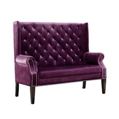 a purple couch sitting on top of a white floor