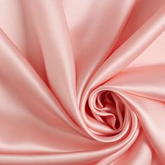 a close up view of a pink satin fabric