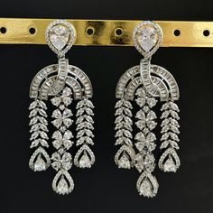 American Diamond earrings/Indian Jewelry/Pakistani Jewelry/Bollywood Jewelry/CZ earrings/AD earrings/Statement earrings/Gift for her Height = 70 mm || Width = 27 mm Bollywood Look American Diamond Earring Color, shades, and texture displayed may slightly vary from the actual product due to digital image limitations. We request you to consider these minor variations. Please expect the possibility of some slight imperfections when buying handmade jewelry. If you have any questions, please contact us. Please let me know if you have any questions. Thank you so much for visiting my shop. Diamond Earrings Indian, Ad Earrings, American Diamond Earrings, Jewelry Pakistani, Earrings Indian, Bollywood Jewelry, Pakistani Jewelry, Diamond Earring, Cz Jewelry