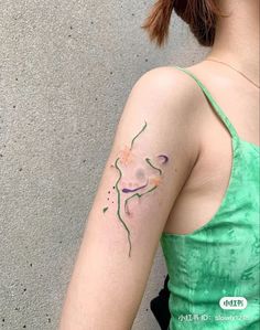 a woman with a tattoo on her arm