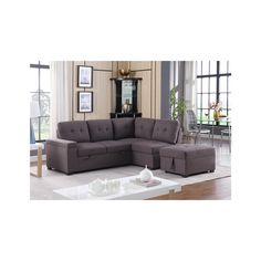 a living room with a sectional couch and coffee table