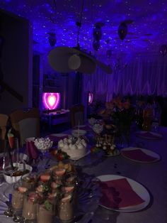 a table is set up with desserts and drinks for a party or special occasion