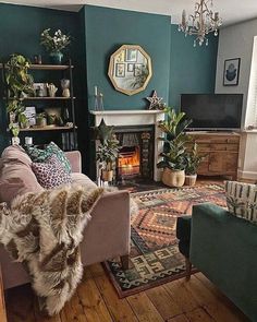 a living room filled with furniture and a fire place in the middle of the room