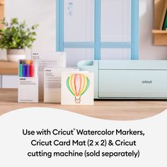 the cricut machine is sitting next to its box and instructions on how to use it