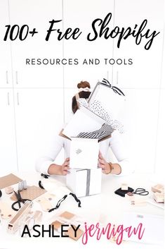 a woman is holding two boxes with the words, 100 + free shopify resources and tools