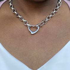 The Amanda Heart Necklace is a simple and elegant piece, designed with a delicate heart for a look that's so different from the rest. A tough stainless steel chain makes this necklace a fashion favorite. Product Details- Necklace: about 17 inches long; links: 10x14x4mm- Heart: 25x24x5mm - Material: Stainless Steel Dainty Choker Necklace, Layered Choker Necklace, Necklace And Bracelet Set, Detailed Necklace, Jewelry Accessories Ideas, Heart Chain, Jewelry Fashion Trends, Gold Necklace Women, Pearl Pendant Necklace