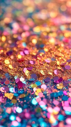 an image of colorful glitter with lots of sparkles on it's surface in the background