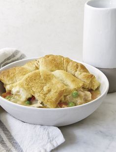 a white bowl filled with chicken pot pie