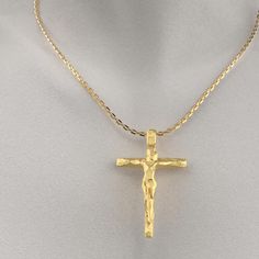 Italian Crucifix Necklace in 18k or 14k Gold. This modern crucifix necklace is a beautiful and elegant way to express your faith. The crucifix is made of genuine 18k or 14k gold and features a stylized design with a facetted surface. The cross is optionally suspended from a sturdy Forzatina chain made of solid gold. 14k or 18k Gold Pendant width: 30 Millimeters, Pendant height: 46 Millimeters Handmade in Italy Formal Yellow Gold Crucifix Necklace, Formal Yellow Gold Crucifix Cross Necklace, Gold Crucifix Cross Necklace For Formal Occasions, Yellow Gold Crucifix Cross Necklace For Formal Occasions, Luxury Crucifix Cross Necklace For Formal Occasions, Luxury Gold Crucifix Cross Necklace, Cross Necklace For Men, Neutral Jewelry, Crucifix Necklace