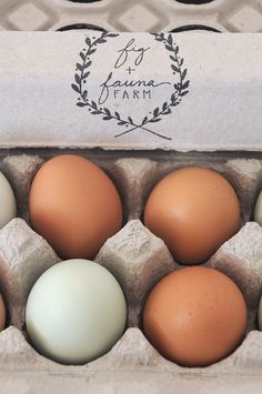 an egg carton with six eggs in it and a label for the farm on top