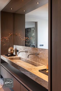 a bathroom with two sinks and a large mirror