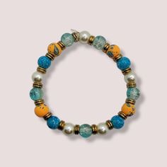 Handmade Orange, Blue, Pearl Beaded Bracelet Made Of Elastic, Beads And Metal Alloy Wooden Beaded Bracelets, Pandora Charms Disney, Paris Bracelet, Gemstone Cuff Bracelet, Pearl Beaded Bracelet, Tree Of Life Bracelet, Glass Bangles, Hematite Bracelet, Enamel Bangle