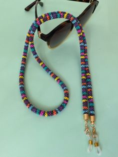 The perfect accessory for your wardrobe, adding a finishing touch to your outfit. Multi-functional glasses, sunglasses and mask chain holder with multi-colored beads. It can also be used as a necklace. Thank you in advance for choosing my designbycolla store. If you have a question, I can answer immediately. My three-functional product, which can be eyeglass chain, necklace, bracelet, is completely made with the help of handmade crochet. This eyeglass chain can be a very perfect choice for your Crochet Glasses Chain, Crochet Glasses, Handmade Gift For Mom, Sunglasses Chain, Beaded Crochet, Rainbow Beads, Eyeglass Chain, Glasses Chain, Eye Wear Glasses