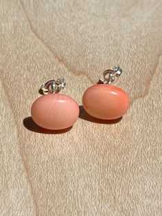 Oval Pink Coral Gemstone Post Earrings with Sterling Silver Materials: pink coral gemstone cabochons, sterling silver post earrings Stone Size: 8x10mm domed oval Not sure what size you need? The pink eraser on the end of a pencil is 7mm. Pop one off and hold it to your ear. 8mm would be just slightly bigger, 6mm just slightly smaller and so on Shipped in a box ready for gifting to someone special or to keep for yourself. Classic Coral Jewelry As Gift, Classic Coral Jewelry Gift, Oval Coral Jewelry For Gift, Coral Earrings For Gift, Coral Oval Jewelry For Gifts, Pink Cabochon Earrings As Gift, Formal Coral Oval Jewelry, Sterling Silver Oval Cabochon Earrings, Classic Cabochon Clip-on Earrings Gift