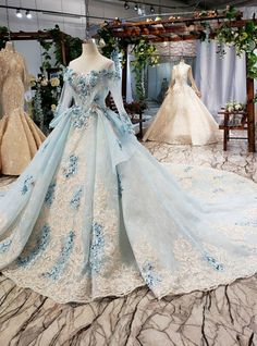 If you are looking for a perfect and long lace for your marriage, this mind-blowing ball gown with a scoop neckline is perfect for you. Some well-fitted hand made flowers are added across the neckline along with the long Sleeve that is also added to it. The back of the gown is also well decorated with a premium lace-up back style and a small opening that is also added to bring out the beauty of the gown. The skirt of the gown has a design that is spread across part of it. It has some flapping design that is also attached to the waist of the wedding dress. Ball Gowns Fantasy, Blue Ball Gown, Women Robe, Blue Ball Gowns, 파티 드레스, Blue Ball, Princess Ball Gowns, Wedding Dresses Beaded, Ball Gowns Evening