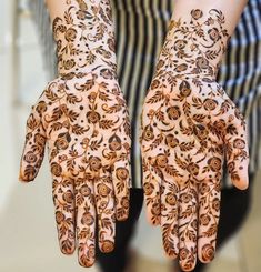 the hands are decorated with intricate designs