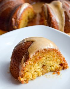 a bundt cake with icing on a white plate