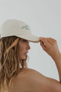 Designed for versatility, just like the Cara Loren brand, the Luxe Sports Cara ball cap is the Spring wardrobe staple you’ve been searching for. Whether you’re headed to a workout or brunch with friends, this classic ball cap with a curved brim is a timeless outfit completer. The Luxe Sports ball cap includes embroidered lettering for an elevated, true luxe finish. 100% cotton twill is the best combination of breathability + durability. An adjustable strap on the back makes this hat size customi Brunch With Friends, Cara Loren, Embroidered Lettering, Timeless Outfits, Halo Style, Wearing A Hat, Find Color, A Workout, Spring Wardrobe