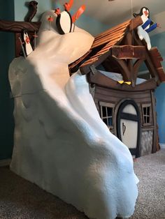 there is a fake iceberg with penguins on it