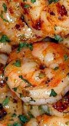 closeup of cooked shrimp with parsley on top