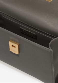 Inspired by Grace Kelly's enduring style, the Grace Top Handle Bag is meticulously crafted from premium USA full-grain textured calfskin leather, ensuring both durability and elegance. Its timeless and versatile design features a thoughtfully structured interior that comfortably accommodates all your everyday essentials. Whether day or night, you'll find yourself instinctively reaching for this chic and easy-to-wear masterpiece. High-end Epsom Leather Shoulder Bag For Everyday Luxury, High-end Business Shoulder Bag With Leather Lining, High-end Epsom Leather Bag For Everyday Luxury, Classic Everyday Luxury Shoulder Box Bag, Everyday Luxury Epsom Leather Textured Bags, Timeless Calf Leather Flap Bag For Everyday, Timeless Textured Leather Shoulder Bag For Office, High-end Everyday Leather Flap Bag, Timeless Textured Leather Satchel For Office