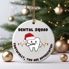 a christmas ornament with a tooth on it