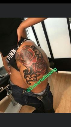 a woman with a tattoo on her back