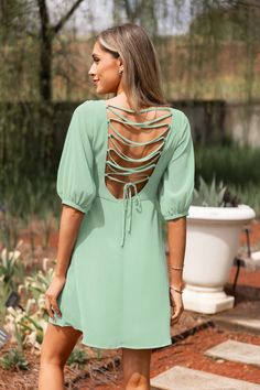 Refresh your style with the Mint Blouson Sleeve Lace-Up Back Mini Dress. This charming dress features voluminous sleeves and a lace-up back that adds a playful twist to its chic silhouette. Product code: CAA05A4D118PP Features:  Woven V-neckline Blouson half sleeves Front keyhole Open back with lace-up tie closure Mini Wash Method: Regular Wash Material: 100%POLYESTER. Flowy Lace-up Back Dress For Brunch, Casual Backless Dress With Lace-up Back, Chic Spring Mini Dress With Lace-up Back, Summer Short Sleeve Mini Dress With Lace-up Back, Puff Sleeve Dresses With Tie Back For Brunch, Puff Sleeve Dress With Tie Back For Brunch, Short Sleeve Mini Dress With Lace-up Back For Summer, Spring Backless Dress With Cutout Back For Day Out, Spring Brunch Backless Dress With Smocked Back