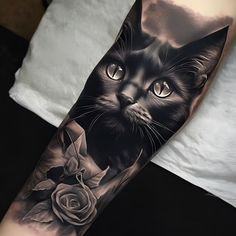 black cat with rose tattoo on arm