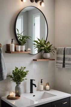 a bathroom sink with a mirror above it and two candles on the counter next to it