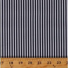 black and white striped fabric with wooden ruler