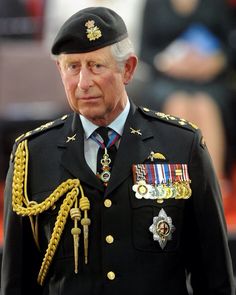 an older man in uniform walking down the street