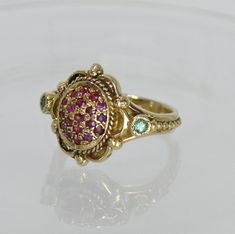 Very Unique Victorian HAND MADE 14K Gold Ring 19 RUBY + 2 EMERALD Measurement : Size: Custom / Adjustable WIDTH : 1.5 CENTIMETER WEIGHT : 5.7 GRAM FREE SHIPPING EXPRESS MAIL Heirloom Ruby Ring In Yellow Gold, Antique Ruby Ring In Yellow Gold, Antique Yellow Gold Ruby Ring, Gold Ruby Cluster Ring In Fine Jewelry Style, Fine Jewelry Gold Ruby Cluster Ring, Gold Ruby Cluster Ring Fine Jewelry, Oval Multi-stone Ruby Ring In Yellow Gold, Yellow Gold Ruby Cluster Ring With Multi-stone, Heirloom Ruby Birthstone Ring