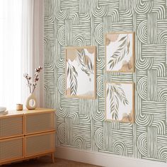 a living room with wallpaper that looks like art deco style paintings on the wall