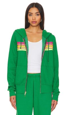 Find AVIATOR NATION X 5 Stripe Hoodie In Green on Editorialist. Aviator Nation X REVOLVE 5 Stripe Hoodie in Green. - size L (also in M, S, XL, XS) Aviator Nation X REVOLVE 5 Stripe Hoodie in Green. - size L (also in M, S, XL, XS) 50% polyester 38% cotton 12% rayon. Made in USA. Machine wash. Front zipper closure. Drawstring hood. Side slant pockets. Fleece lining. Item not sold as a set. ANAT-WK86. HDRS5-KGRNPNKY. Who doesn't have an obsession with vintage clothing? Paige Mycoskie, creator of Av Green Hoodie Outerwear In Athleisure Style, Green Sweatshirt With Drawstring Hood, Green Hooded Jacket With Drawstring For Sports, Green Hooded Jacket With Ribbed Cuffs, Green Athleisure Top With Drawstring Hood, Green Athleisure Outerwear With Drawstring Hood, Green Sporty Hoodie With Adjustable Hood, Green Athleisure Hooded Jacket For Winter, Sporty Green Hooded Jacket With Drawstring