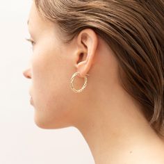 A twist above the everyday, our 14K Yellow Gold double row twisted oval hoops add a textured elegance and an artisanal sophistication to every outfit. Elegant Hammered Oval Hoop Earrings, Elegant Oval Hammered Hoop Earrings, Elegant Twisted Hoop Earrings For Everyday, Textured Hoop Earrings For Everyday Wear, Everyday Textured Hoop Earrings, Gold Texture, Gold Jewelry, Twist, Yellow Gold