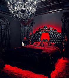 a fancy bed with red lights and chandelier