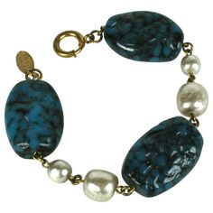 Miriam Haskell pate de verre and faux baroque pearl bracelet composed of three oversized faux lapis Gripoix glass handmade glass beads and two stations of large and medium alternating Miriam Haskell signature faux pearls. Excellent Condition, Signed. Length 7.75" x Width .75" Miriam Haskell Jewelry, Bracelet Art, Faux Pearl Bracelet, Vintage Green Glass, Miriam Haskell, Handmade Glass Beads, Handmade Design, Baroque Pearls, Pearl Bracelet