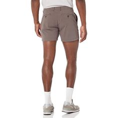 Upgrade your summer wardrobe with these sleek Slim Fit Flat Front Chino Shorts. Crafted from a soft and durable cotton blend with a touch of elastane, these shorts offer a comfortable fit with just the right amount of stretch. With a button closure and button-through back pockets, they are both stylish and functional. Details: 98% Cotton, 2% Elastane Button closure Machine Wash Fitted through hip and thigh, with a tapered leg. Sits below the waist Soft, durable cotton blend with a gentle stretch Cotton Bermuda Shorts With 5-inch Inseam For Summer, Casual Slim Fit Bottoms For Summer, Stretch Cotton Shorts With 5-inch Inseam, Slim Fit Summer Shorts, Slim Fit Summer Bottoms Short Length, Stretch Cotton Bermuda Shorts With Elastic Waistband, Summer Slim Fit Shorts, Casual Stretch Cotton Bermuda Shorts, Stretch Cotton Bermuda Bottoms