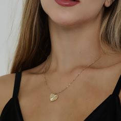 This 14K gold-filled necklace features a sunburst heart with a CZ stone in the center. This sunburst heart necklace is a thoughtful gift for any special moments. Layer on the love by pairing it with any necklace. Length: 18 inches 14K Gold filled chain, clasp and findingsCharm is brass based with 14K gold plating Sunburst Necklace, Special Moments, Gold Filled Chain, Cz Stone, Necklace Length, Gold Plating, Heart Necklace, Thoughtful Gifts, Gold Filled