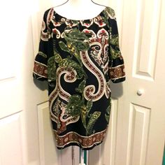 New With Tag. Comfy And Roomy. Paisley Print Off/On Shoulder Dress. Navy Blue And Multiple Color. Made In The U.S.A. 100% Polyester. Fits To Size. Loose Fit. Chest Laying Flat: 23in. Total Length 34in. Bell Sleeve. Tag: 305 Short Sleeve Paisley Print Vacation Dresses, Short Sleeve Dresses With Paisley Print For Vacation, Short Sleeve Paisley Print Dresses For Vacation, Summer Tunic Dress With Paisley Print, Short Sleeve Patterned Dress With Paisley Print, Short Sleeve Paisley Print Patterned Dress, Spring Paisley Print Tunic Dress, Elegant Flowy Paisley Print Dress, Patterned Floral Print Tunic Dress