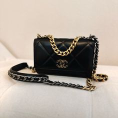 100% Authentic Chanel 19 Wallet On Chain In Black And Gold Hardware With Crossbody Strap Comes With Card Dustbag And Box. Bought In January 2023. Black With Red Interior Card Holders Chanel (Identification Is No Longer On A Card, It's Placed In The Bag) 7.5 X 4.7 X 1.6 Inches Sold Out Everywhere, Impossible To Find*** Barely Worn. Excellent Condition. Scuffs And Dust From Storage Will Be Cleaned/Wiped Prior To Shipment. The Bag Is From A Clean Owner Who Doesn’t Smoke And Collects Handbags. The Bag Is Well Stored And Cared Of With No Odors Or Damages. More Photos Can Be Requested, Feel Free To Send A Message :) Chanel 19 Wallet On Chain, Chanel Cross Body Bag, Black And Gold Hardware, Chanel 19, Chain Purse, Wallet On Chain, January 2023, Red Interior, In The Bag