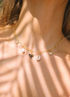 Set sail with our Voyage Charm Necklace, your must-have accessory for summer adventures. This 24k gold plated adjustable necklace, is perfect for a day spent swimming in the ocean or catching the sunset. 24k Gold Plated 16" Chain Images Courtesy of Voyage Charm Jewelry For Beach, Handmade Gold Charm Necklace For Vacation, Yellow Gold Jewelry For Vacation, Gold Charm Necklace For Vacation, Gold Charm Necklaces For Vacation, Gold Necklaces For Beach, Gold Vacation Jewelry With Charms, Gold Charms Jewelry For Vacation, Vacation Gold Jewelry With Charms