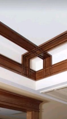 a room with wood trim on the ceiling