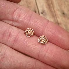 These adorable small post earrings are made with you choice of 14k rose gold filled material. They come with a rubber earring back so they are safe for even sensitive ears as well as comfortable. Due to high demand these earrings will take approximately 5 business days before shipping. Matching ring: https://www.etsy.com/listing/226841132/rose-ring-rose-gold-free-shipping-14k?ref=listing-shop-header-3 * Because these earrings are handmade no two are exactly alike. What is Gold-Filled? Gold-fille Gold Rose Earrings For Gift, Hypoallergenic Rose Gold Flower Earrings For Gift, Dainty Rose Gold Flower Earrings For Gift, Dainty Rose Gold Flower Earrings As Gift, Dainty Rose Gold Earrings As Gift, Dainty Nickel-free Rose Gold Earrings, Tiny Dainty Rose Gold Earrings, Delicate Hypoallergenic Rose Gold Flower Earrings, Hypoallergenic Rose Gold Flower Earrings