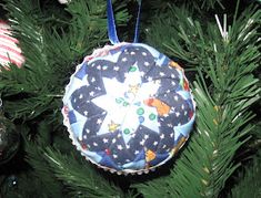 a christmas ornament hanging from a tree