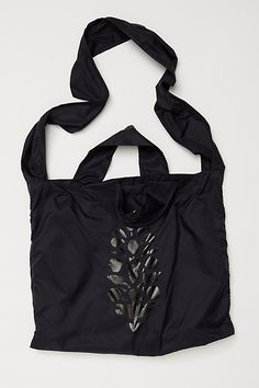 a black bag with an animal print on it