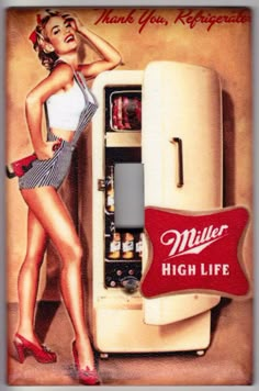 a woman standing next to an old refrigerator