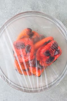 there are carrots wrapped in plastic to look like they have been placed on the table